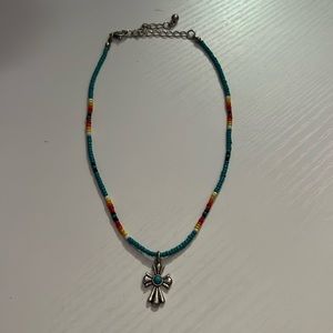 Cross necklace, mostly turquoise, never worn, from a boutique.